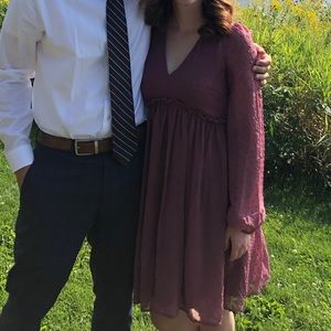 Formal dress with sheer sleeves.